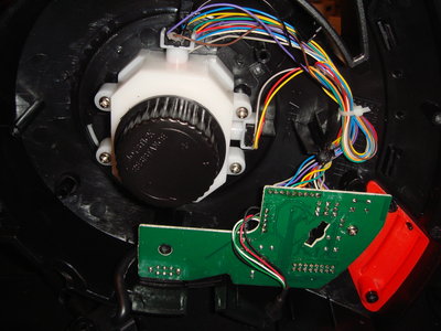 base plate off, showing two black pots for ail/ele and the circuit board.  At top center area there are 3x3 dots are the connections to pots.each vertical column is for one pot.<br />the big black round knob in the middle of the white box is for adjustment of joystick tension.<br />the rudder/twist pot is inside the white cover<br />the big black round knob is for adjustment of joystick tension.