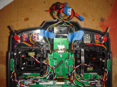 there is a connector to switch whether using the Tx sticks or the joystick during this transition phase.  In the pic the tx sticks are connected.  I need that 6 pin JST socket to make these connectors, so I cut out the HK backlight connector and use the 5V from tx adding a 470 ohm resistor to power the backlight.