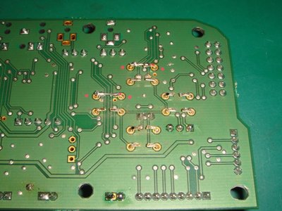 those wires were soldered to main board as shown with the previous button footing left on there as solder joint. The 4 points with those two pairs of red dots shorted as Iksbob described.