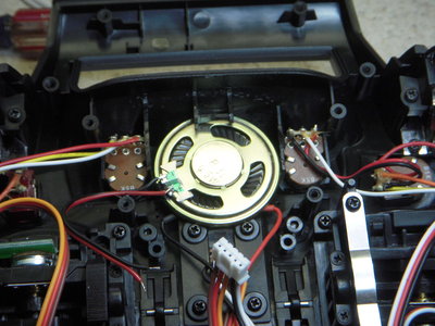 The bottom of the speaker needs to be flush with the washers under the power switch mounting screws.